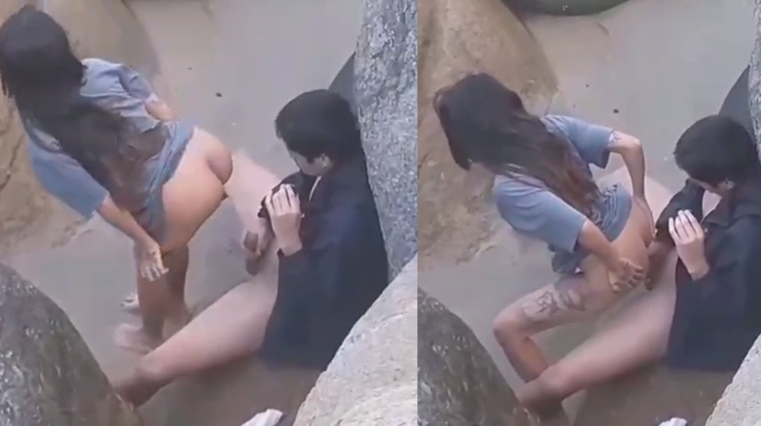 Voyeur records two strangers fucking between stones on the beach