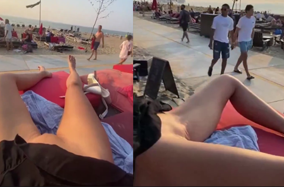 Woman shows her pussy to passersby on the beach
