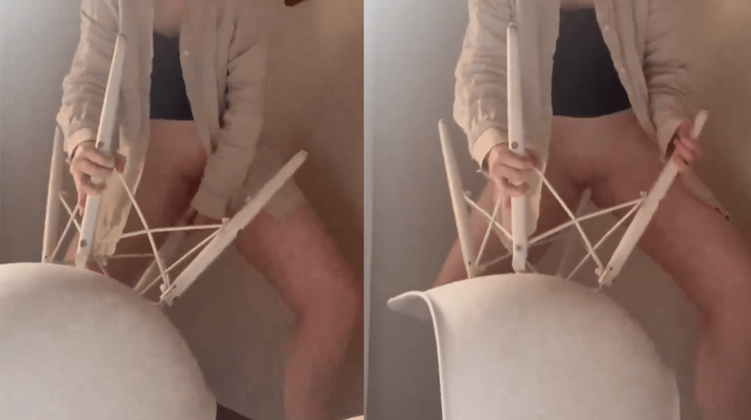 She sticks a chair leg in her pussy