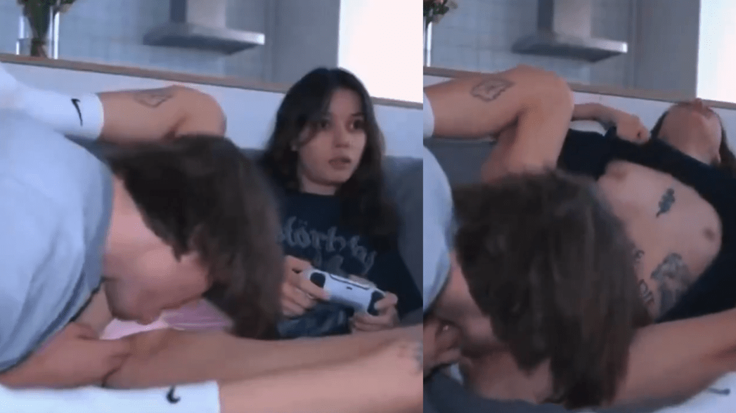 The girlfriend plays video games and he performs cunnilingu on her